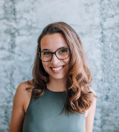 headshot of gorgeous young woman with eyeglasses