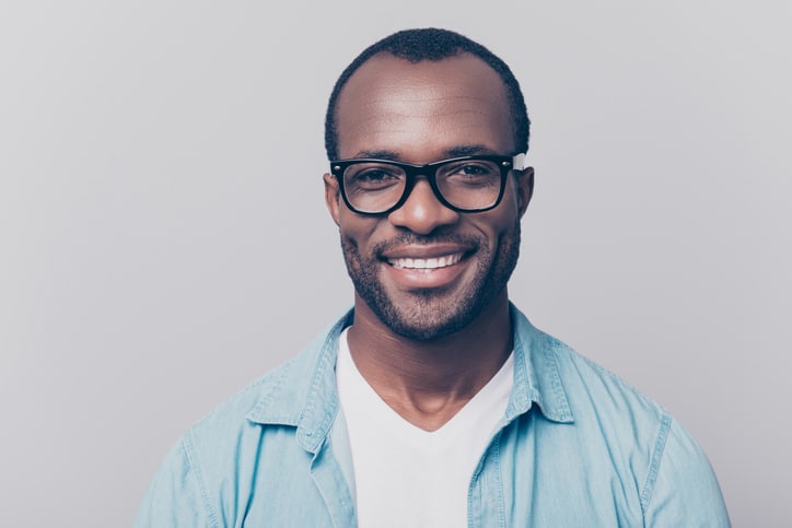 A portrait of a middle-aged man with glasses.