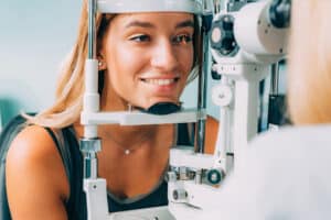 A woman with strabismus getting an eye exam