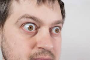 A cropped shot of a man with bulging eyes