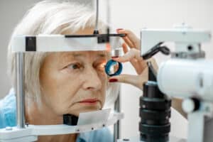 Senior woman getting an eye exam who may have glaucoma in Loveland, CO