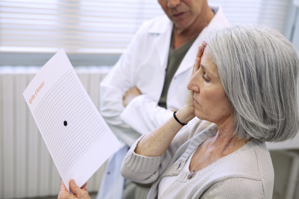 Senior woman doing an eye test for age-related macular degeneration in Loveland, CO
