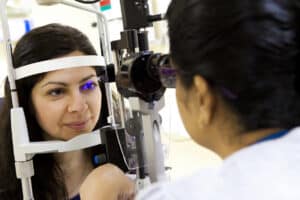 Woman having her eyes examined for cataracts in Loveland, CO