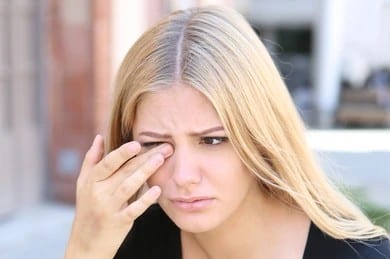 Woman with something in her eye needing treatment in Loveland, CO